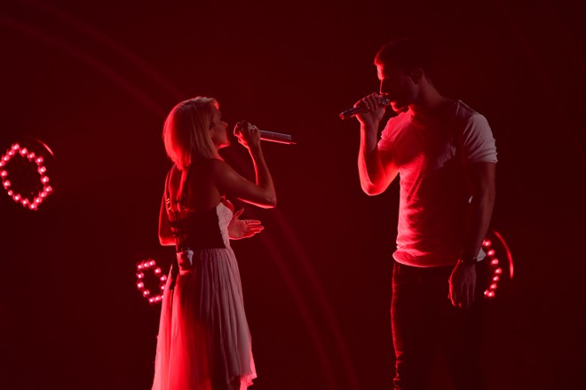 Carrie Underwood eSam Hunt. | Robyn Beck/AFP