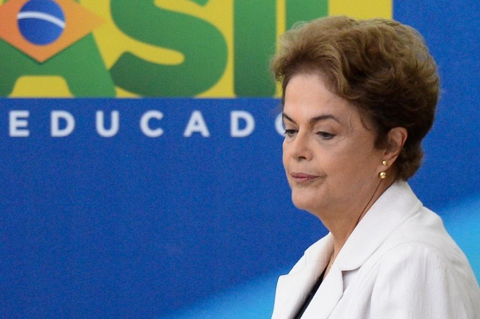 Presidente Dilma Rousseff tem enfrentado pressão para que renuncie ao cargo. | Andressa Anholete/AFP