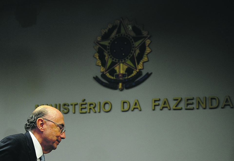 Henrique Meirelles volta à alta cúpula do Planalto cinco anos após ter deixado a presidência do Banco Central: ele é peça-chave na estratégia do governo para reerguer a economia. | Andressa Anholete/AFP