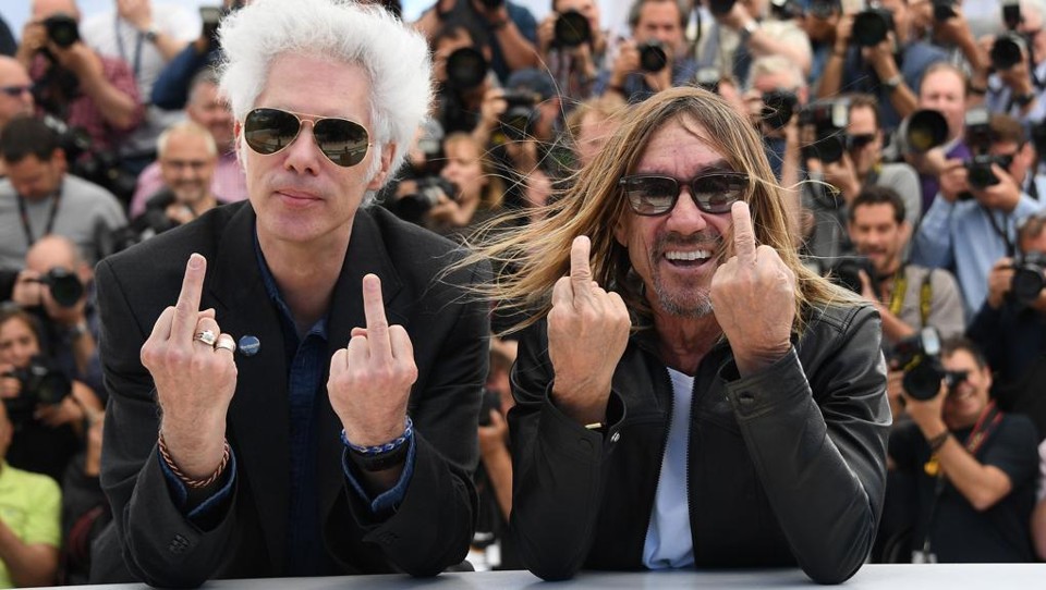 Jim Jarmusch e Iggy Pop durante apresentação de “Gimme Danger”, em Cannes | ANNE-CHRISTINE POUJOULAT/AFP