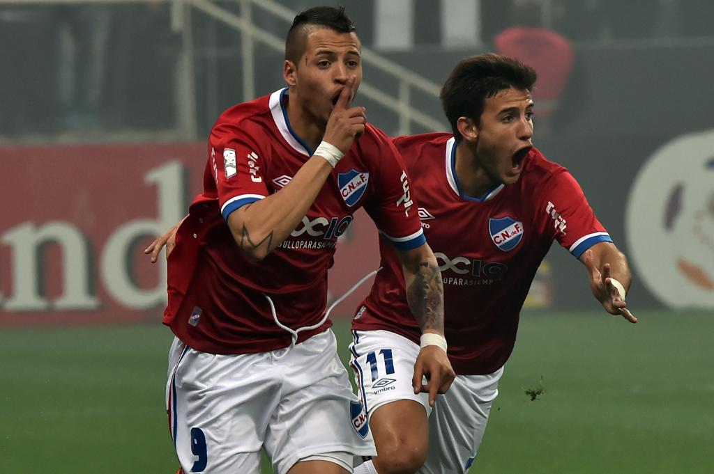 Nico López faz sinal de silêncio após marcar oprimeiro gol da noite no Itaquerão: 2 a 2 classificou os uruguaios. | Nelson Almeida/AFP
