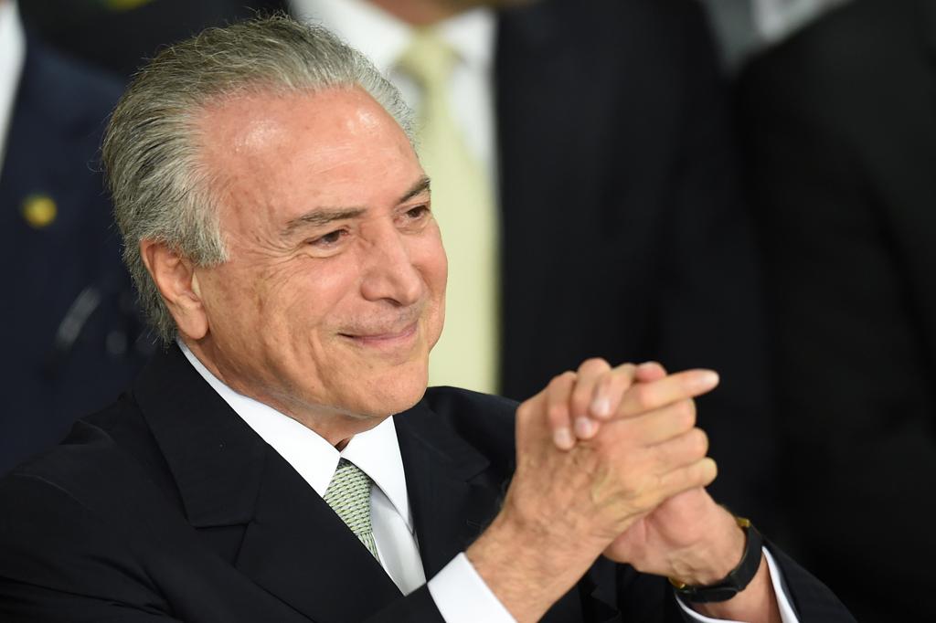 Presidente interino Michel Temer tem pouco tempo para fazer o país voltar a crescer. | Evaristo Sá/AFP