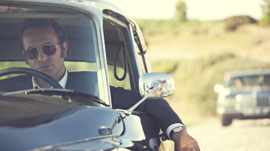 Jean Dujardin vive o juiz Pierre Michel, que tenta acabar com a maior quadrilha de drogas da Europa | Jerome MACE/Divulgação
