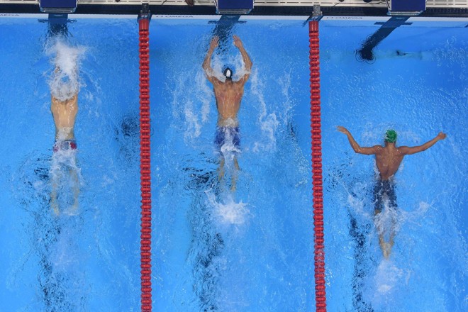 Michael Phelps chegou em primeiro lugar, seguido por Masato Sakai, do Japão, e Tamas Kenderesi, da Hungria. | FRANCOIS-XAVIER MARIT/AFP