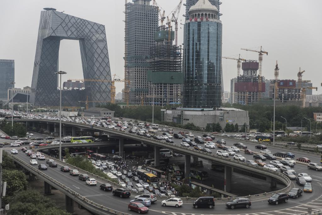 Com um população de cerca de 21 milhões de habitantes,  Pequim tem hoje 5,6 milhões de carros, mais do dobro que dez anos atrás. | GILLES SABRIE/NYT