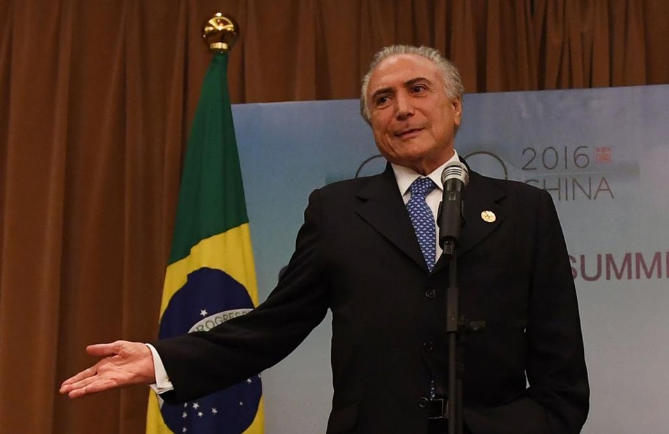 | GREG BAKER/AFP