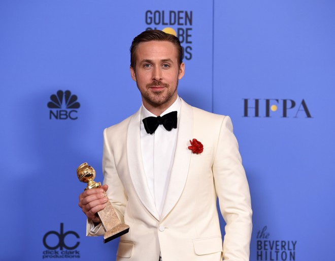 Ryan Gosling, vencedor de Melhor ator de comédia ou musical. | ROBYN BECK/AFP