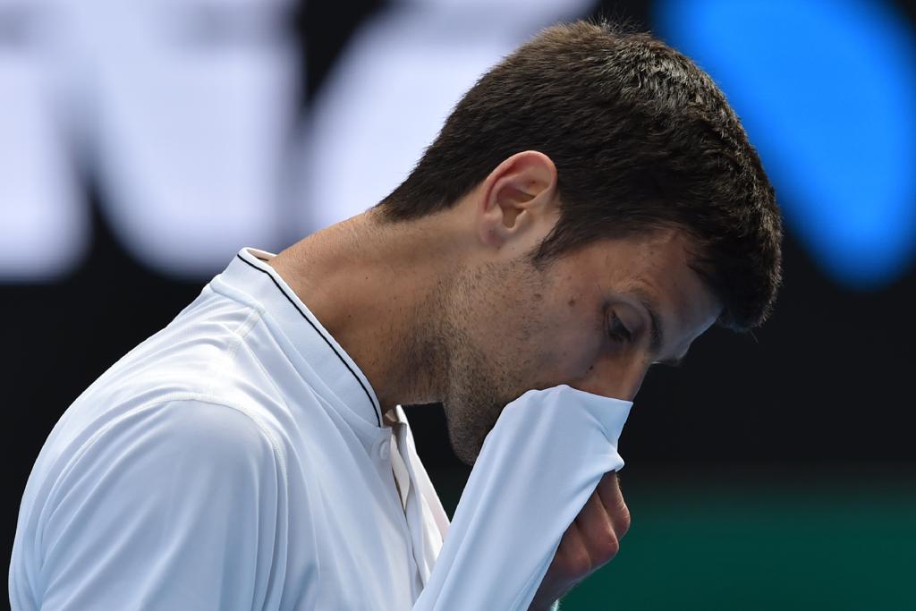 Djokovic caiu logo na segunda rodada do Aberto da Austrália de 2017. | PAUL CROCK/AFP
