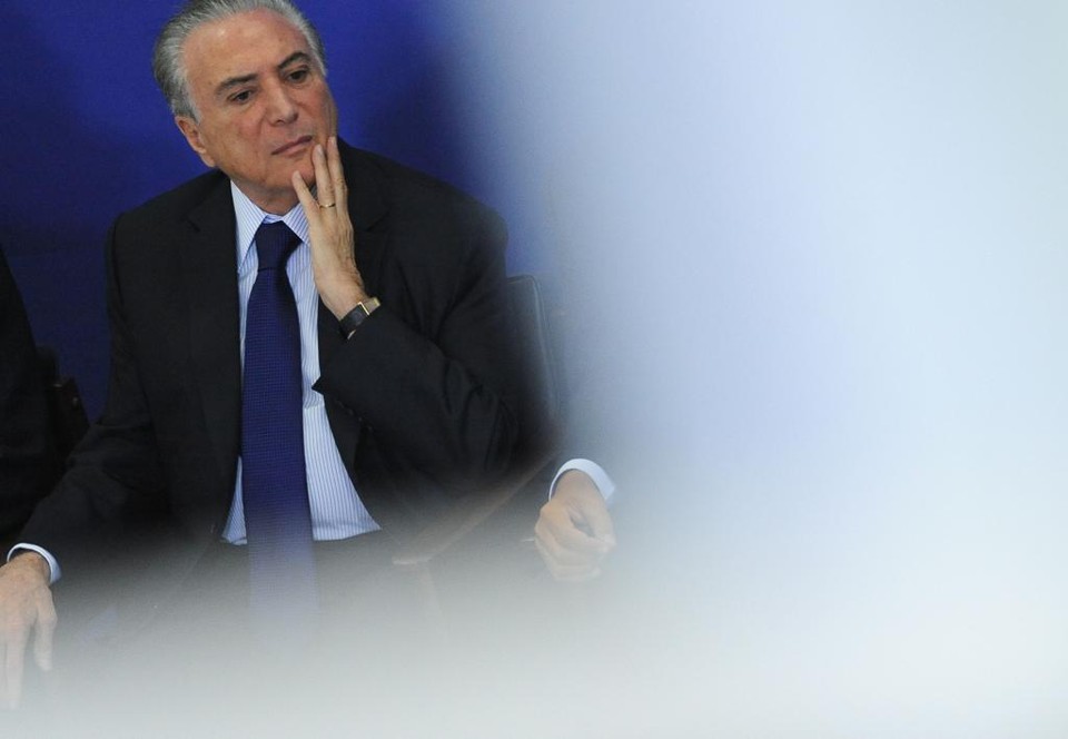 Temer parece se preparar para as pesadas nuvens que se formam sob Brasília: as revelações das delações-bomba dos executivos da Odebrecht. | Andressa Anholete/AFP