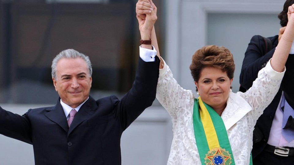 Temer (à esq.) e Dilma | EVARISTO SA/AFP