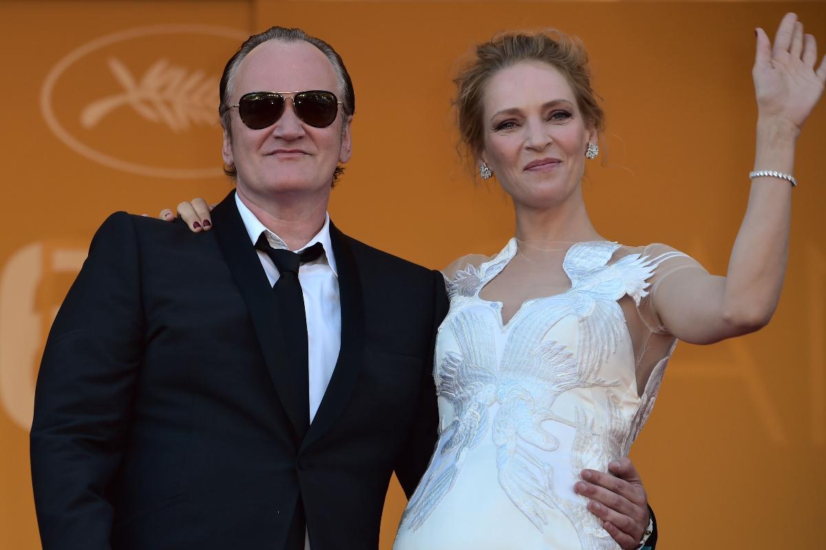 Quentin Tarantino e a atriz Uma Thurman durante o Festival de Cannes, em 2014 | BERTRAND LANGLOIS/AFP