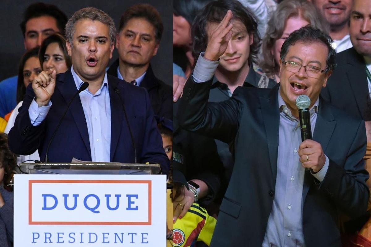 Os dois candidatos à presidente que disputarão o segundo turno: Iván Duque e Gustavo Petro | Luis Acosta / Raul ArboledaAFP PHOTO