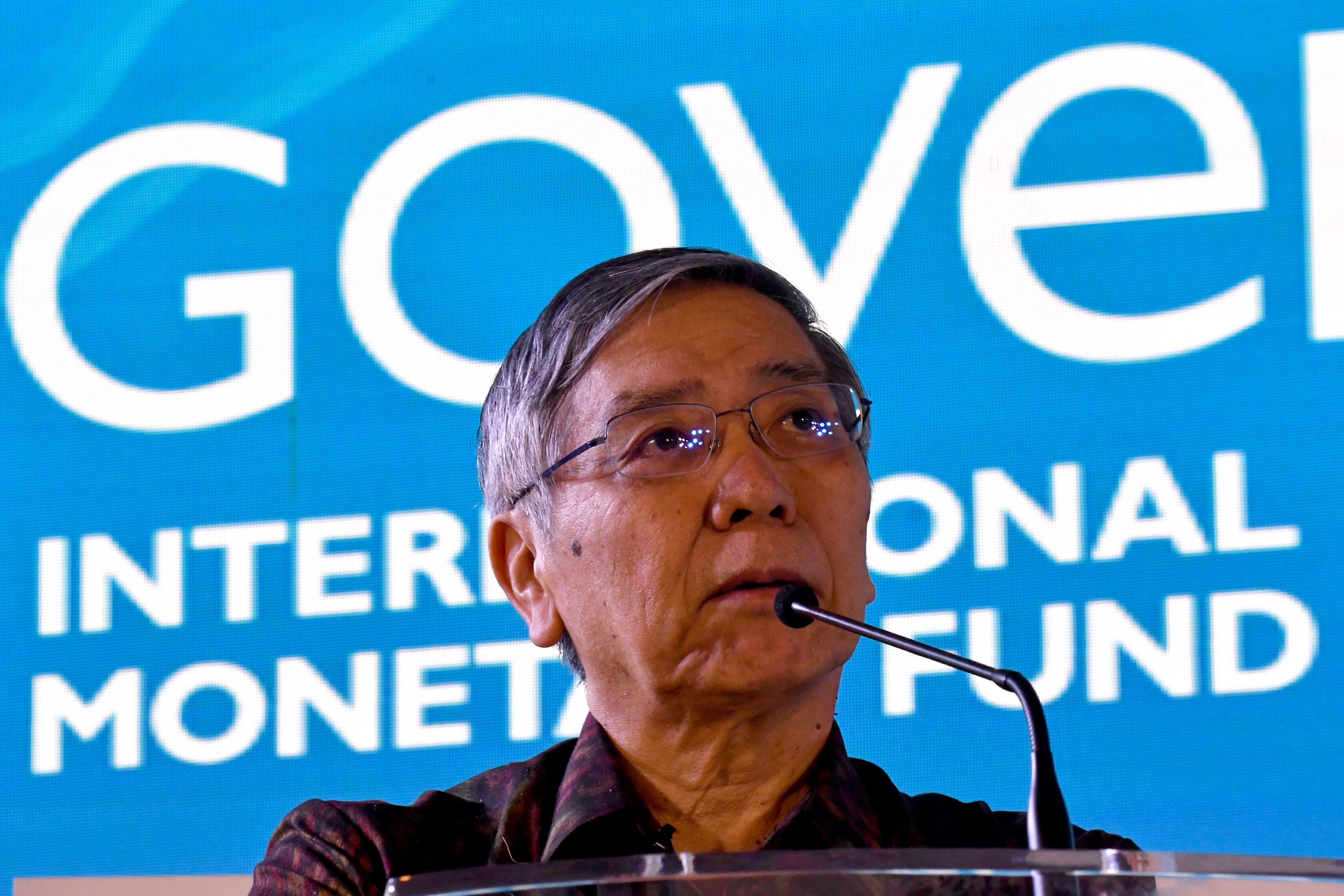 Haruhiko Kuroda, presidente do banco central japonês, minimizou riscos apontados por Mario Draghi, presidente do Banco Central Europeu. | Goh Chai Hin/AFP