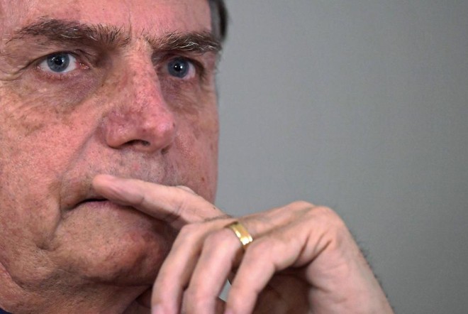 Presidente eleito, Jair Bolsonaro diz que não deve mais realizar a fusão entre as pastas do Ministério da Agricultura e do Meio Ambiente. | CARL DE SOUZA/AFP