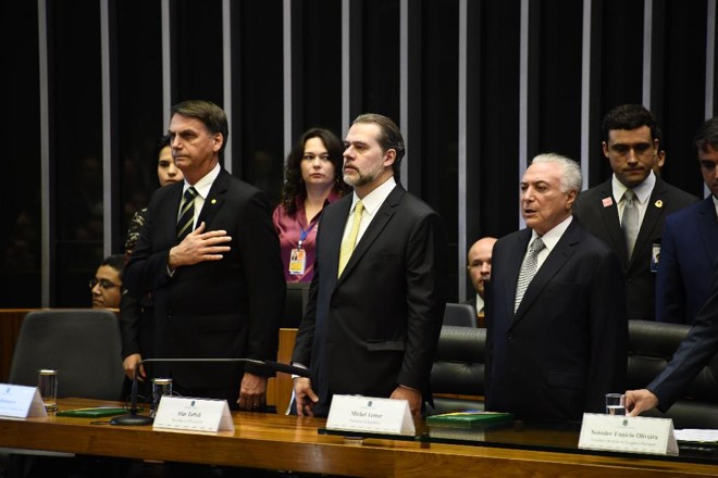Bolsonaro participou de sessão solene no Congresso, nesta terça-feira (6), ao lado de Dias Toffoli e Michel Temer | Evaristo SA/AFP