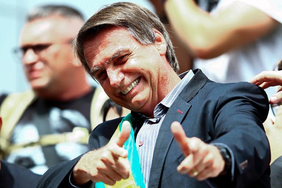 Bolsonaro define seus 22 ministros. Conheça quem são e a nova estrutura de governo O presidente eleito definiu quem são os 22 ministros do seu governo. Agora o foco é no segundo escalão, no qual Bolsonaro aceitará sugestões de partidos. | Heuler Andrey/AFP