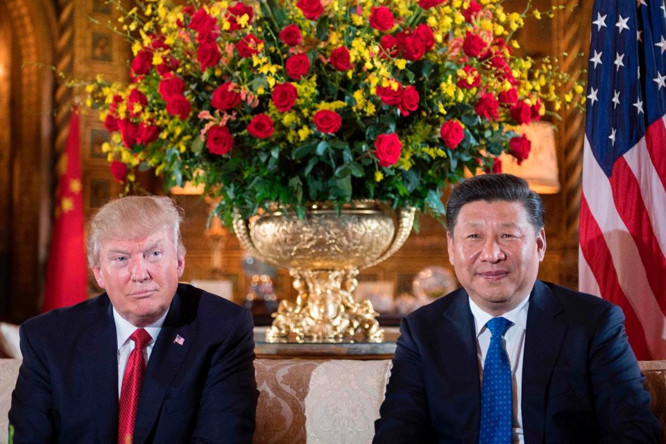 Presidente dos EUA, Donald Trump, e presidente da China, Xi Jinping | JIM WATSON/AFP