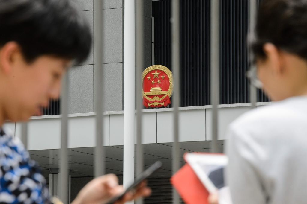 Chineses são muito adeptos das tecnologias financeiras pelo celular | ANTHONY WALLACE/AFP