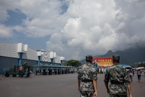 Membros  do Exército de Libertação do Povo Chinês em Hong Kong | Paul Yeung/Bloomberg