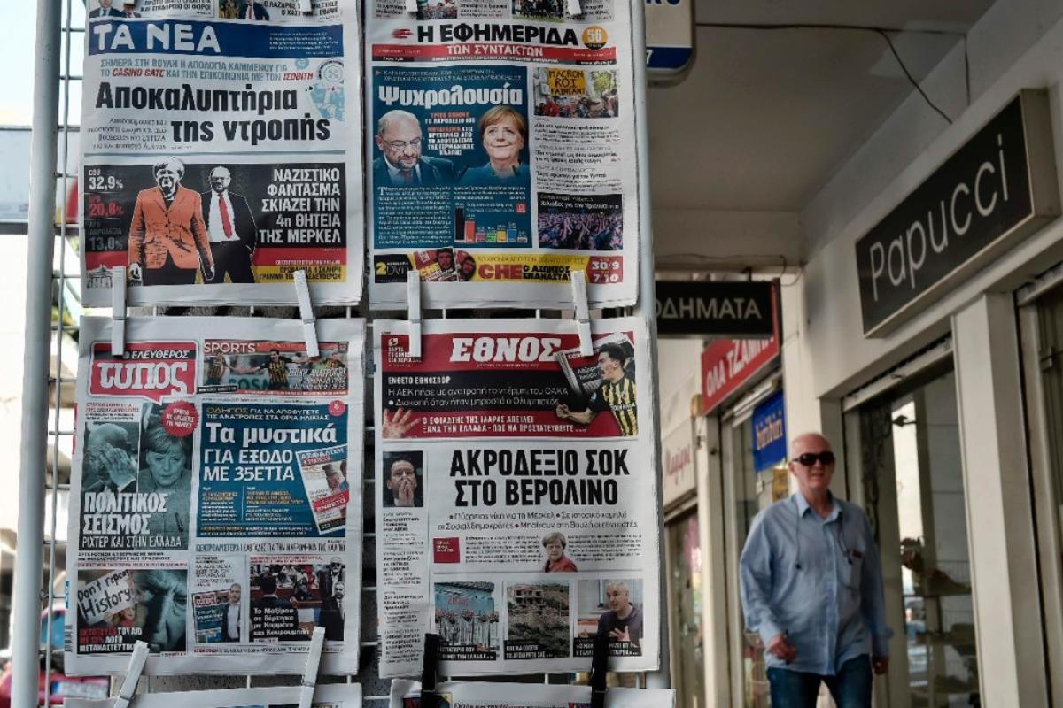 Capas de jornais gregos mostram resultado das eleições na Alemanha | Louisa Gouliamaki/AFP