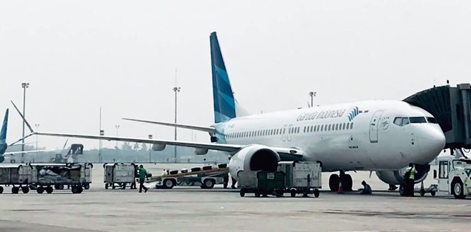 Aviões Boeing 737-Max 8 com a pintura da Garuda Indonesia, no aeroporto de Jacarta. | IHWAN IDAMIN HARAHAP/AFP