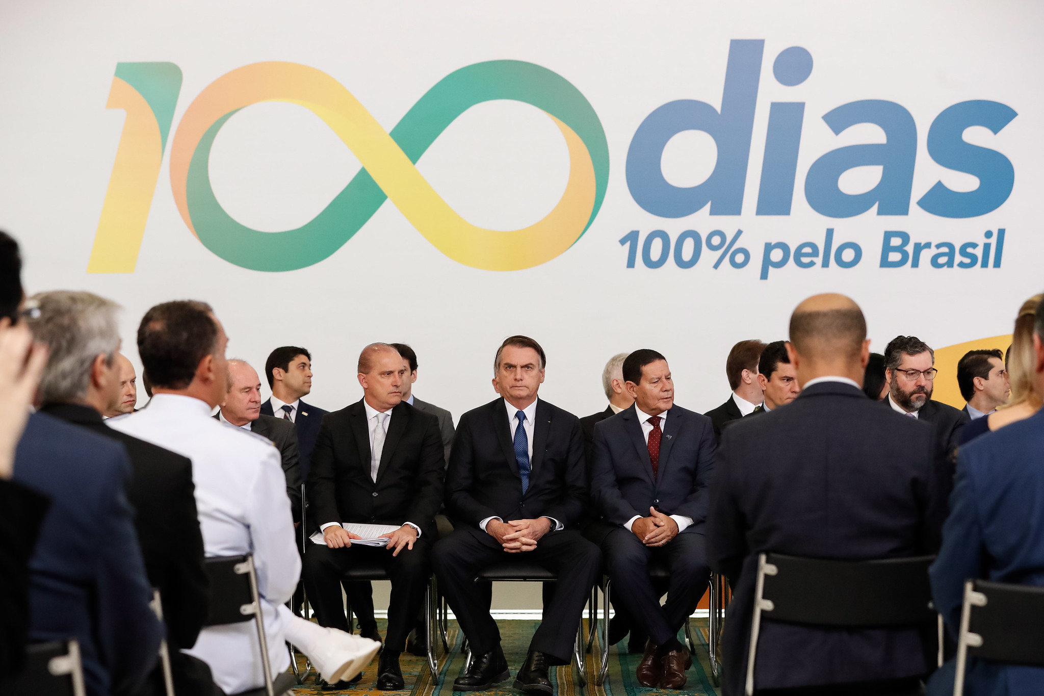 Onyx Lorenzoni, Jair Bolsonaro e Hamilton Mourão em evento pelos 100 dias do governo.