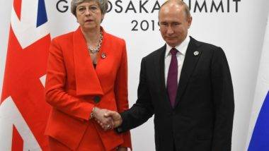 Theresa May e Putin se encontram pela primeira vez após caso de envenenamento Theresa May e Putin se encontram pela primeira vez após caso de envenenamento