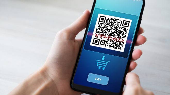 QR code mobile phone scan on screen. Business and technology concept.
