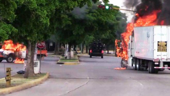 In this AFPTV screen trucks burn in a street of Culiacan, capital of jailed kingpin Joaquin “El Chapo” Guzman’s home state of Sinaloa, on October 17, 2019. – Heavily armed gunmen in four-by-four trucks fought an intense battle against Mexican security forces Thursday in the city of Culiacan, capital of jailed kingpin Joaquin “El Chapo” Guzman’s home state of Sinaloa. (Photo by STR / AFP)
