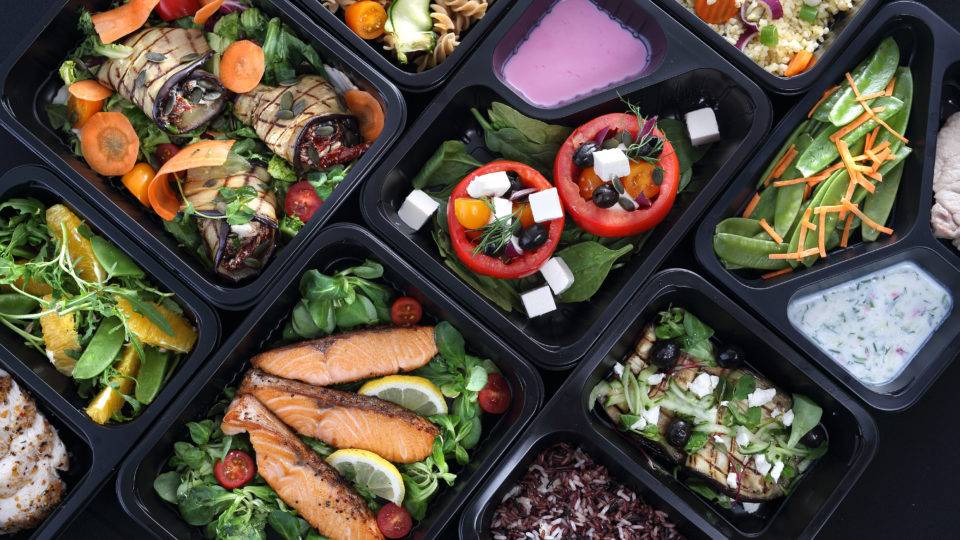 Healthy food and diet concept, restaurant dish delivery. Take away of fitness meal. Weight loss nutrition in foil boxes.