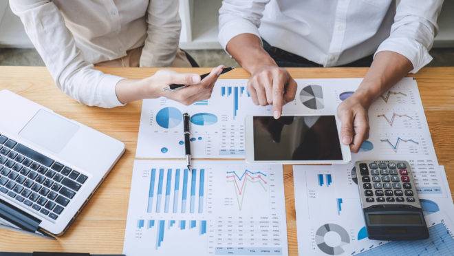 Business casual team manager having a discussion with new project success financial statistics, Partner meeting professional investor working start up project for both company with document.