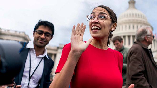 WASHINGTON, DC – On the US Capitol east front plaza 116th Congressional freshman Representatives, like Alexandria Ocasio-Cortez (D-NY), rush off after the Member-Elect class photo on the Capitol Hill in Washington, DC on Wednesday November 14, 2018. (Photo by Melina Mara/The Washington Post via Getty Images)