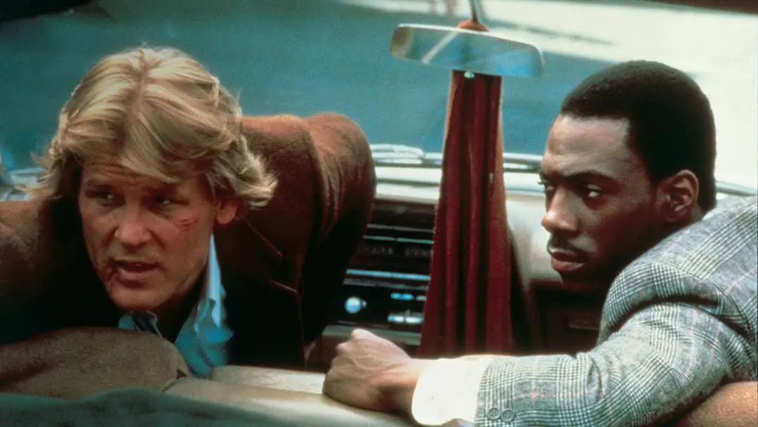 O policial linha-dura vivido por Nick Nolte e o preso interpretado por Eddie Murphy no filme "48 Horas"
