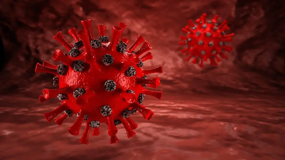 Representação do vírus da Covid-19: gripe e Covid podem reativar células cancerosas adormecidas, elevando o risco de metástase