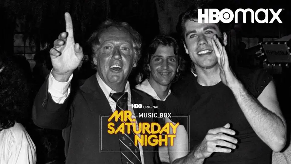 Robert Stigwood ao lado de seu pupilo John Travolta