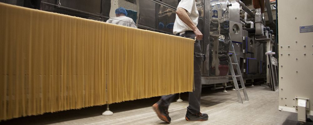 Workers prepare Monograno Spaghettoni pasta at the Pastificio Felicetti factory, which began using only Italian-grown wheat in 2013, in Predazzo, Italy, Dec. 23, 2016. The company's decision to use durum wheat grown exclusively in Italy is paying off in flavor and sales, capitalizing on growing interest in expressions of terroir and feeding Italian pride at a time in which the country could use it. (Cristiano Bendinelli/The New York Times)