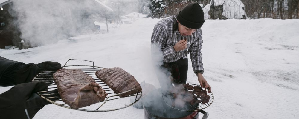 Cezin Nottaway, an Algonquin who runs a catering business, smokes moose meat using a method she learned from her grandmothers in Maniwaki, Quebec, Canada, Dec. 28, 2017. Nottaway is part of a rising generation of indigenous cooks and scholars who are trying to preserve and spread the food culture of their ancestors. (Renaud Philippe/The New York Times)
