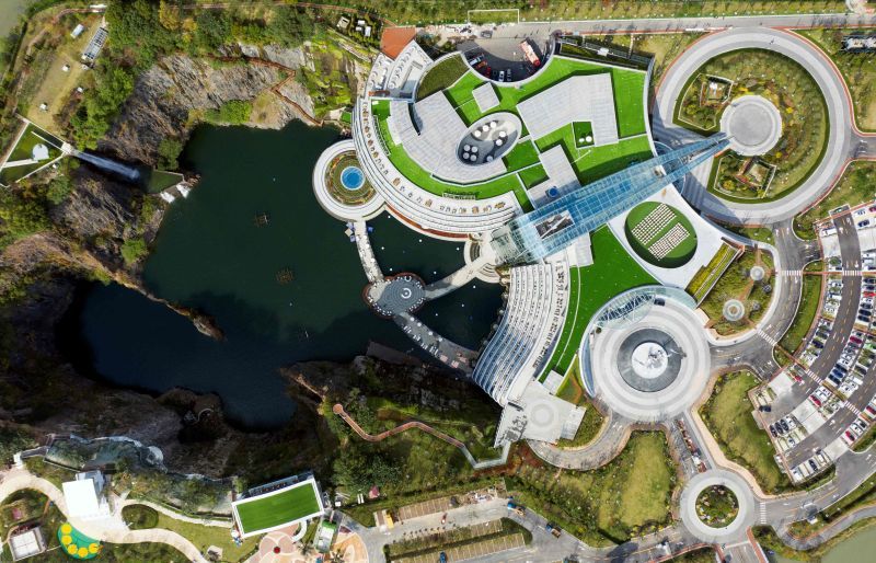 This picture taken on November 13, 2018 shows the grounds of the InterContinental Shanghai Wonderland, built inside a formerly abandoned quarry, about 32 kms (20 miles) southwest of Shanghai. - Engineers faced unique challenges and guests will need deep pockets, but the hotel built into a disused Shanghai quarry opened on November 15 as part of a 288 million USD development. (Photo by Johannes EISELE / AFP) This picture taken on November 13, 2018 shows the grounds of the InterContinental Shanghai Wonderland, built inside a formerly abandoned quarry, about 32 kms (20 miles) southwest of Shanghai. - Engineers faced unique challenges and guests will need deep pockets, but the hotel built into a disused Shanghai quarry opened on November 15 as part of a 288 million USD development. (Photo by Johannes EISELE / AFP)