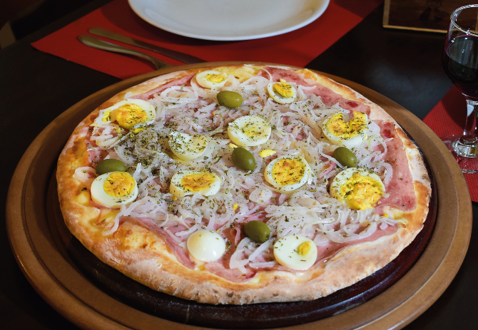 Pizza Portuguesa, do O Rei da Pizza. Foto: Divulgação. Pizza Portuguesa, do O Rei da Pizza. Foto: Divulgação.