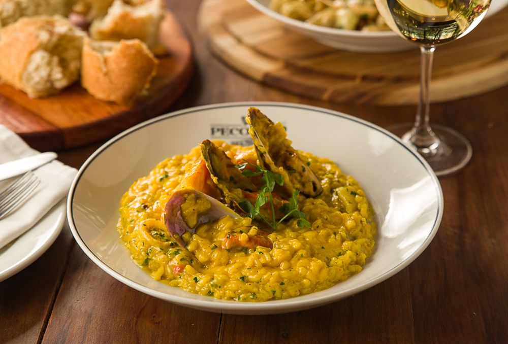 O risoto del mare com lulas, camarões e mexilhões. Foto: Henrique Peron/divulgação. O risoto del mare com lulas, camarões e mexilhões. Foto: Henrique Peron/divulgação.