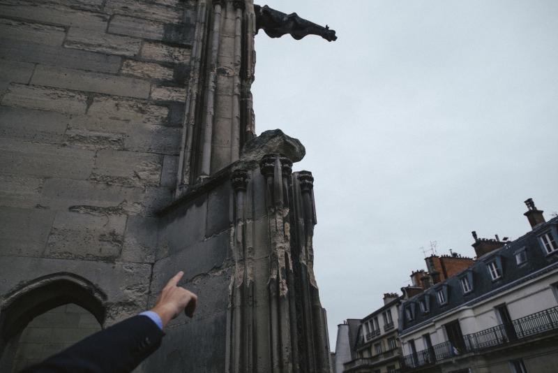 André Finot, spokesman of the Notre Dame Cathedral in Paris, points out eroded masonry on the structure, Sept. 19, 2017. Rain, wind and pollution have battered the cathedral, which is seeking funds in France and in the United States to help pay for extensive renovations. “Everywhere the stone is eroded, and the more the wind blows, the more all of these little pieces keep falling,” he said. (Dmitry Kostyukov/The New York Times) André Finot, spokesman of the Notre Dame Cathedral in Paris, points out eroded masonry on the structure, Sept. 19, 2017. Rain, wind and pollution have battered the cathedral, which is seeking funds in France and in the United States to help pay for extensive renovations. “Everywhere the stone is eroded, and the more the wind blows, the more all of these little pieces keep falling,” he said. (Dmitry Kostyukov/The New York Times)