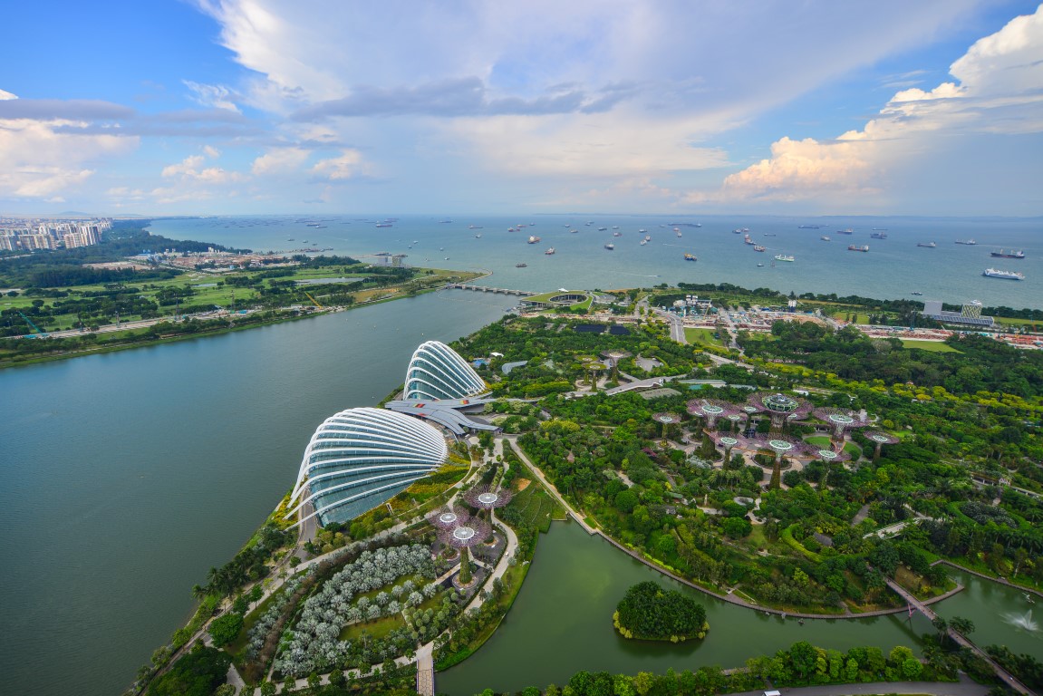 Singapore - Jun 13 2017. Gardens by the Bay at sunny day in Singapore. Gardens by the Bay is a huge colourful futuristic park in the bay area of Singapore. Singapore - Jun 13 2017. Gardens by the Bay at sunny day in Singapore. Gardens by the Bay is a huge colourful futuristic park in the bay area of Singapore.