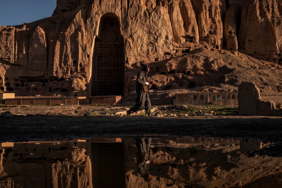 A laborer passes the western Buddha niche in Bamiyan, Afghanistan, May 20, 2019. Since the Taliban destroyed the two giant statues in March 2001, the degradation has continued, as Afghanistan and the international community have spent 18 years debating what to do to protect or restore the site. (Jim Huylebroek/The New York Times) A laborer passes the western Buddha niche in Bamiyan, Afghanistan, May 20, 2019. Since the Taliban destroyed the two giant statues in March 2001, the degradation has continued, as Afghanistan and the international community have spent 18 years debating what to do to protect or restore the site. (Jim Huylebroek/The New York Times)