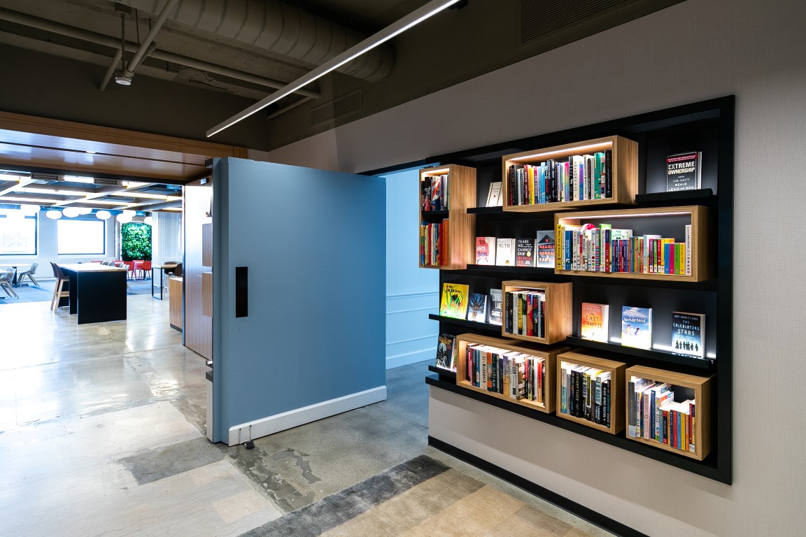 A wall with bookshelves pivots to reveal a secret green room at Macmillan Publishers in New York, Aug. 9, 2019. Secret rooms are popping up in workplaces. (Jeenah Moon/The New York Times) A wall with bookshelves pivots to reveal a secret green room at Macmillan Publishers in New York, Aug. 9, 2019. Secret rooms are popping up in workplaces. (Jeenah Moon/The New York Times)