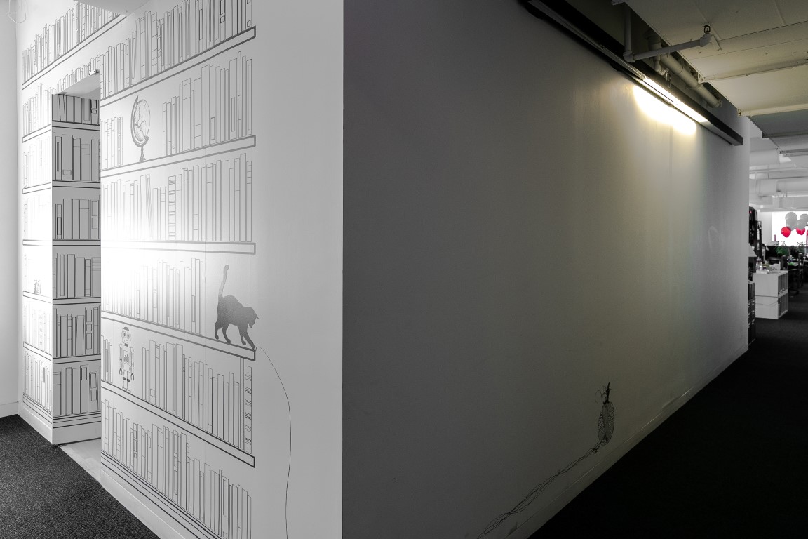 A door in the center of a mural of bookshelves opens inward to a secret library room, at Shutterstock in New York, Aug. 9, 2019. Secret rooms are popping up in workplaces. (Jeenah Moon/The New York Times) A door in the center of a mural of bookshelves opens inward to a secret library room, at Shutterstock in New York, Aug. 9, 2019. Secret rooms are popping up in workplaces. (Jeenah Moon/The New York Times)
