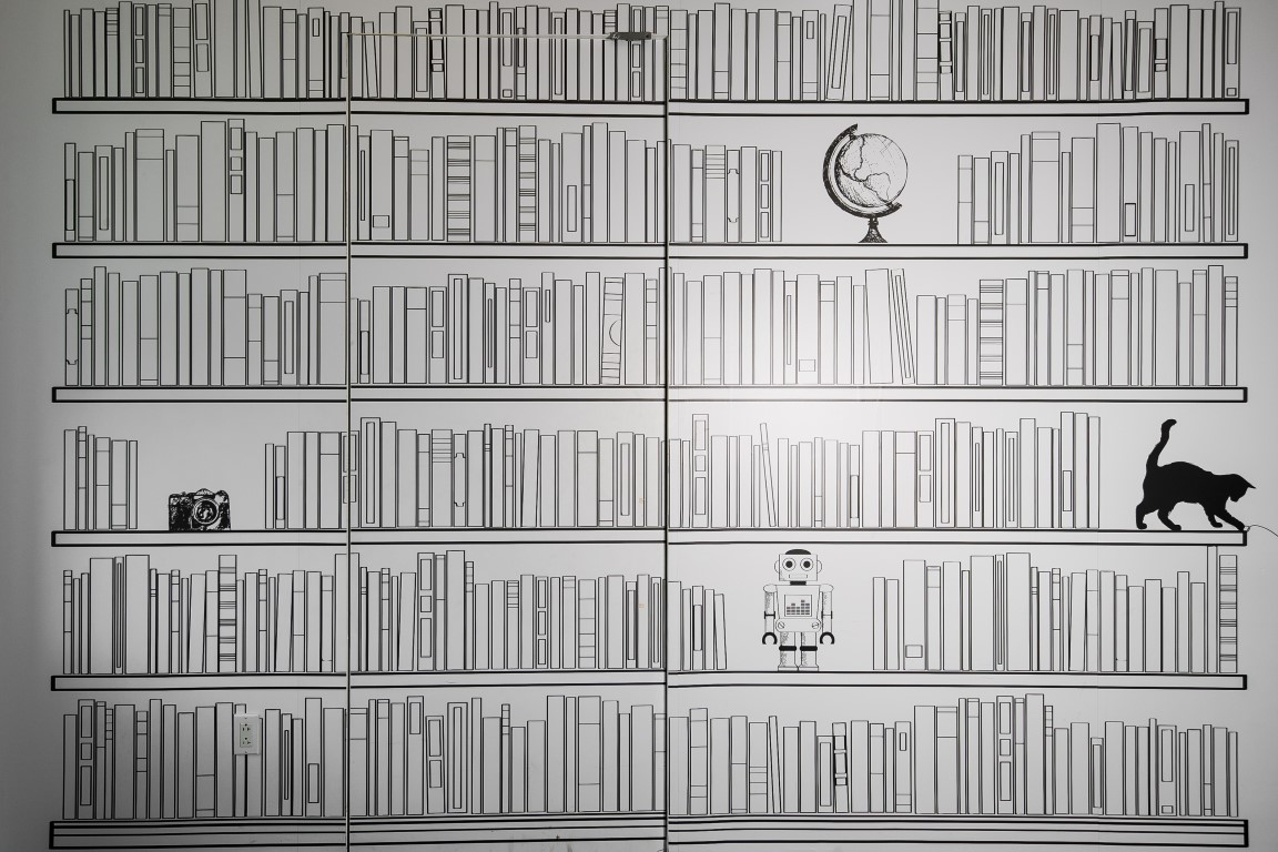 A door in the center of a mural of bookshelves opens to reveal a secret library room, at Shutterstock in New York, Aug. 9, 2019. Secret rooms are popping up in workplaces. (Jeenah Moon/The New York Times) A door in the center of a mural of bookshelves opens to reveal a secret library room, at Shutterstock in New York, Aug. 9, 2019. Secret rooms are popping up in workplaces. (Jeenah Moon/The New York Times)