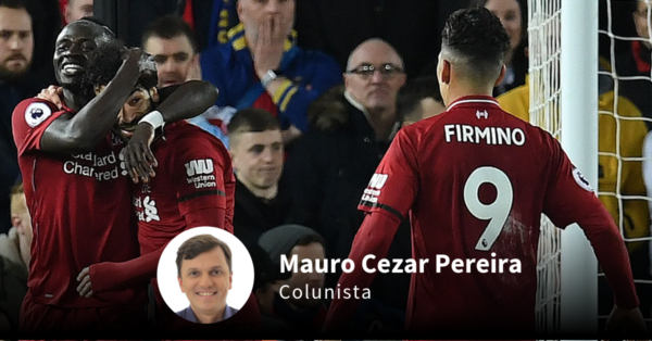 O trio Mané, Salah e Firmino. Paul ELLIS / AFP